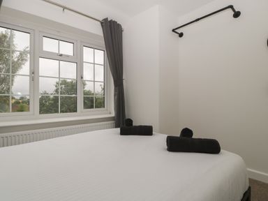 A bedroom with a bed and towels on it at Penny Farthing Inn Aston Crews near Ross-On-Wye
