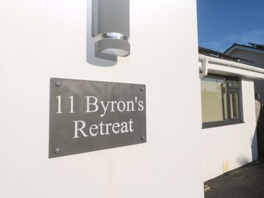 An exterior view of the sign for 11 Byron's Retreat in Crantock