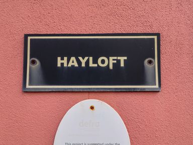 A sign displaying the name Hayloft at Hayloft in Ipswich