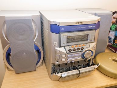 A stereo system with speakers and a 3-disc changer at Hayloft in Ipswich
