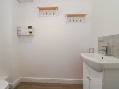 A bathroom with a sink and toilet at 3 The Stables in Highbridge