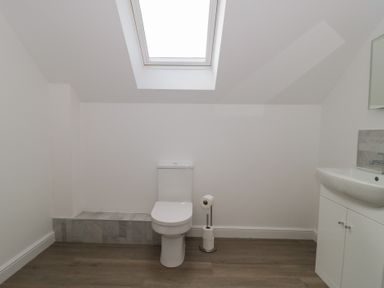 A bathroom with a toilet and sink at 3 The Stables Highbridge