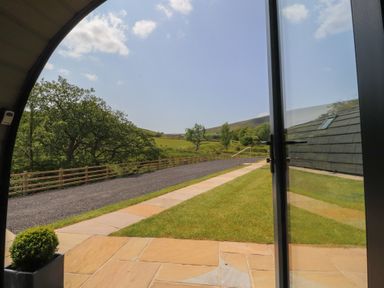 An outdoor view showing a paved pathway and grass at Barley near Nelson