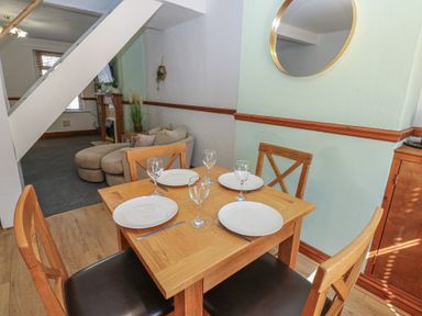 A dining area with a table set for four at Bolton Terrace in Workington