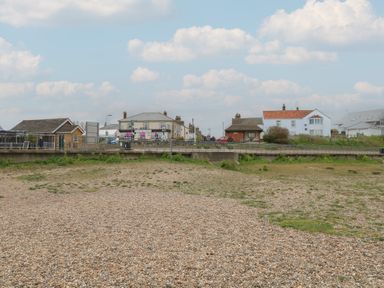 A pebble beach with houses and road at No. 2 - Seaview in Kessingland