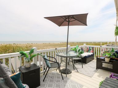 An outdoor seating area with a table and chairs at No. 2 - Seaview Kessingland