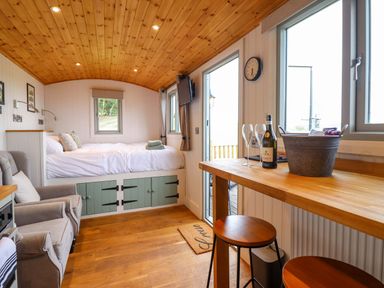 A studio with a bed and seating area at Cheviot in Oswestry