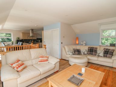 A living room with sofas and a coffee table at 1 Bryn Beudy in Stepaside