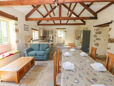 A kitchen with dining area and seating at Carreg Las Haverfordwest