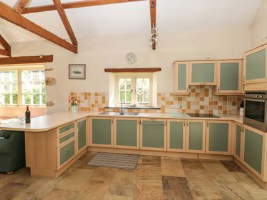 A kitchen with a counter and appliances at Carreg Las Haverfordwest