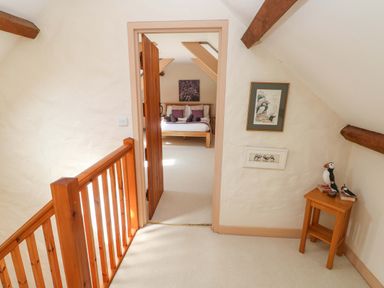A bedroom with a bed and decor at Carreg Las in Haverfordwest