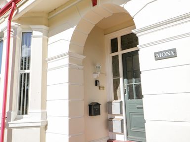An entrance with a door and mailbox at Flat 1A, Mona House in Conwy