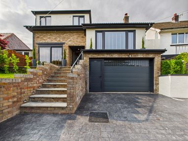 A house with a garage and stairs at 59a Gwscwm Road