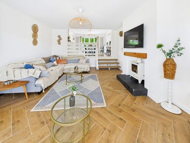 A living room with a sofa and coffee table at 59a Gwscwm Road