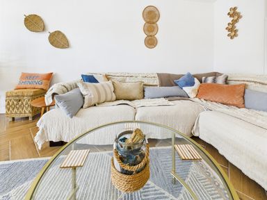 A living room with a sofa and coffee table at 59a Gwscwm Road
