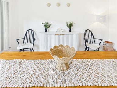 A dining room with a table and chairs at 59a Gwscwm Road
