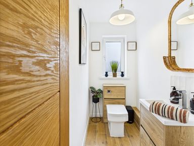 A bathroom with a toilet and sink at 59a Gwscwm Road