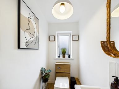 A bathroom featuring a toilet and sink at 59a Gwscwm Road