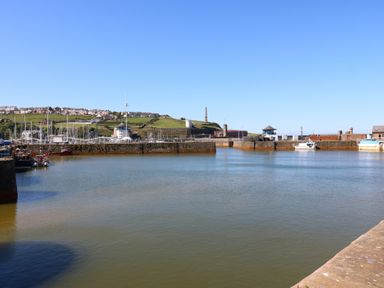 A harbor with boats and buildings at Harbour View in Whitehaven