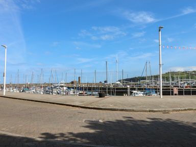 A marina with boats and masts at Harbour View in Whitehaven