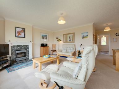A living room with a sofa and television at The Granary in Alnwick