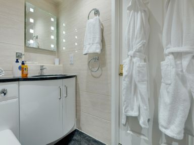 A bathroom with a sink and a mirror at The Granary in Alnwick