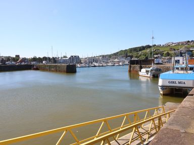 A harbor with boats at Harbourside Apartments Whitehaven