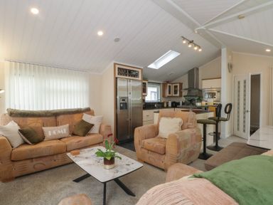 A living room with a sofa and coffee table at Labernum in Lytham St. Annes