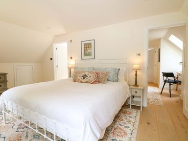 A bedroom with a bed and nightstand at Lakeside Lodge Witherenden Hill near Burwash