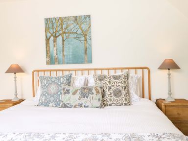 A bedroom with a bed and pillows at Lakeside Lodge Witherenden Hill near Burwash