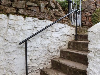 Stairs leading up to a gate at Captains Cottage Brixham