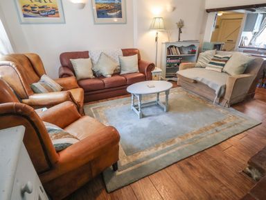 A living room with furniture and decor at Buttercup, Blakeney, Norfolk