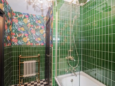 A bathroom with a bathtub and shower at Annexe, East End near Brantham