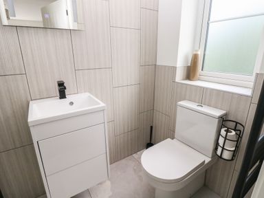A bathroom with a sink and toilet at Ty Landsker in Milford Haven