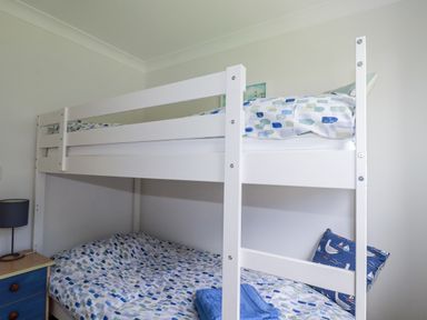 A bunk bed in a bedroom at Acorns in Falmouth