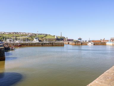 A harbor with boats and buildings at Keekle Terrace in Cleator Moor