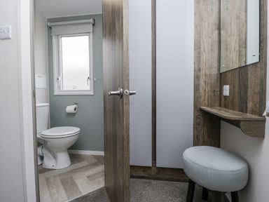 A bathroom with a toilet and sink at Puffin in St Bees