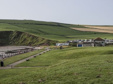 A beach area with grass and pathways at Puffin in St Bees