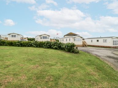 A row of caravans on grass at Puffin in St Bees