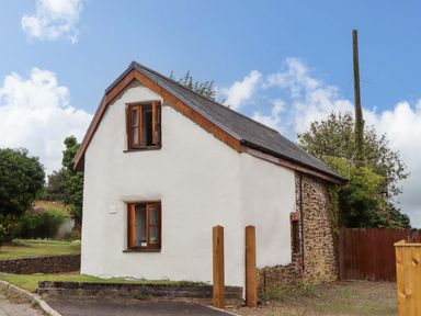 A house with windows in the exterior at Church Barn in Sutcombe near Bradworthy