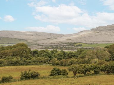 A landscape with hills and trees at Kate's Cottage