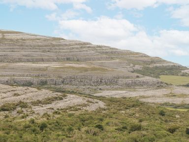 A landscape with mountains and rock formations at Kate's Cottage