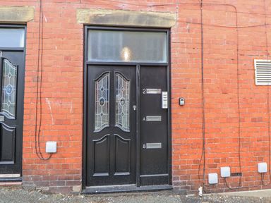 A front entrance with a door and intercom at No 2 Emporium Apartments Prestatyn