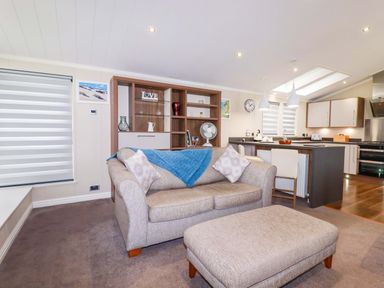 A living room with a sofa and coffee table at The Maples 44 St. Austell