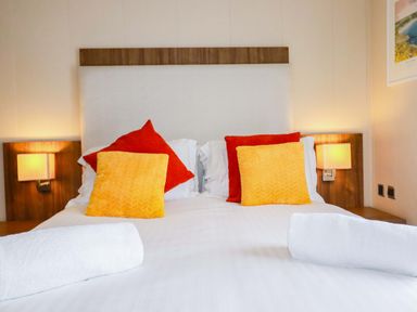 A bedroom with a bed and pillows at The Maples 44 St. Austell