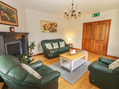 A living room with sofas and a coffee table at Ash House in Ballyvaughan
