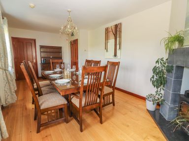 A dining room with a table and chairs at Ash House Ballyvaughan