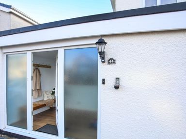 An entrance with a door and coat hooks at Penrhos Walks Holyhead