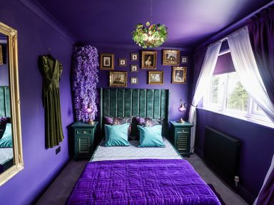 A bedroom with a bed and decorative elements at Holly Farm near Brantham
