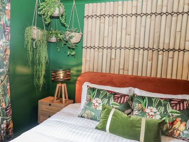 A bedroom with a bed and wall decor at Holly Farm near Brantham